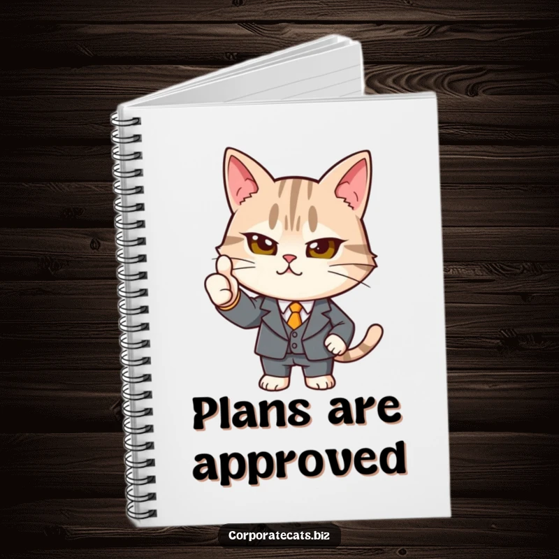 Funny determined cat notebook in a tiny suit giving a strong thumbs-up, a humorous stationery item for jotting down plans with approval.