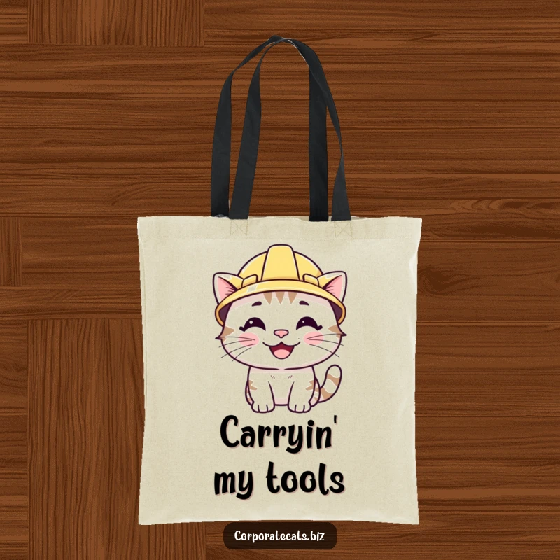 Funny tote bag featuring a smiling cat wearing a miniature hard hat. A humorous and practical accessory for projects.